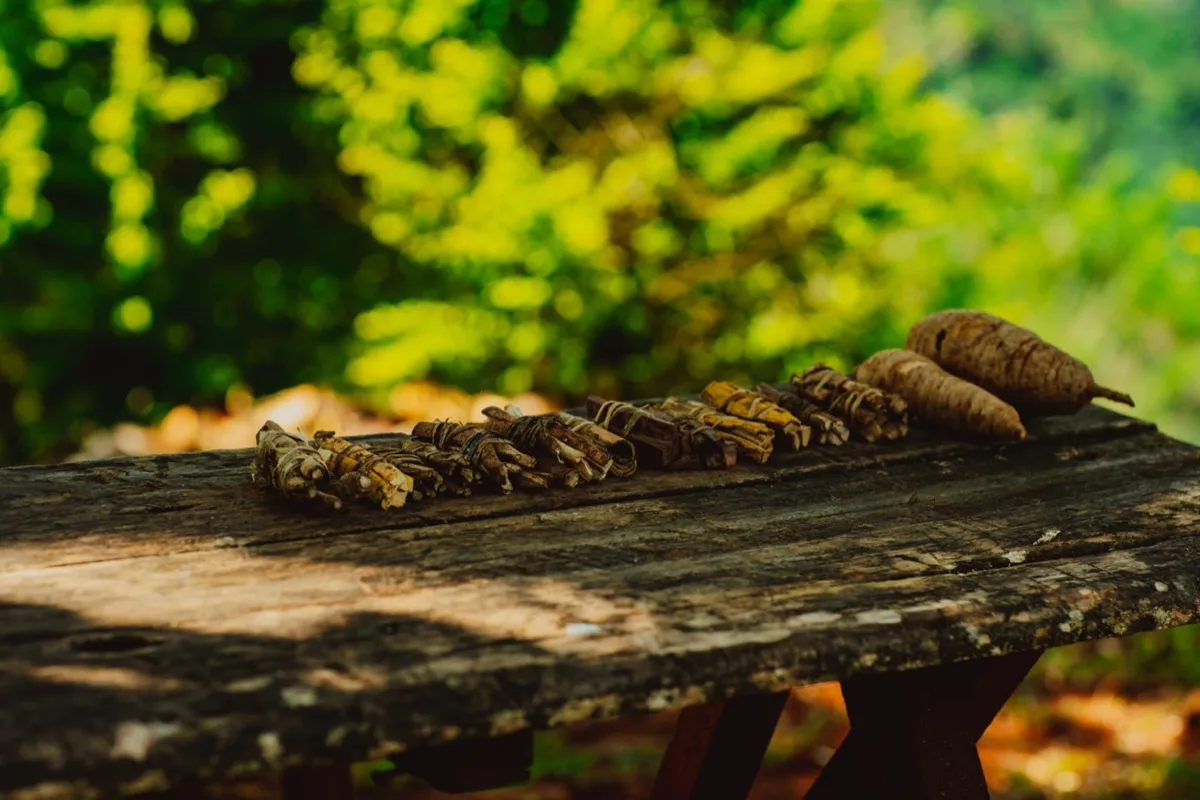 Bundles of estate-grown spices on a rustic table